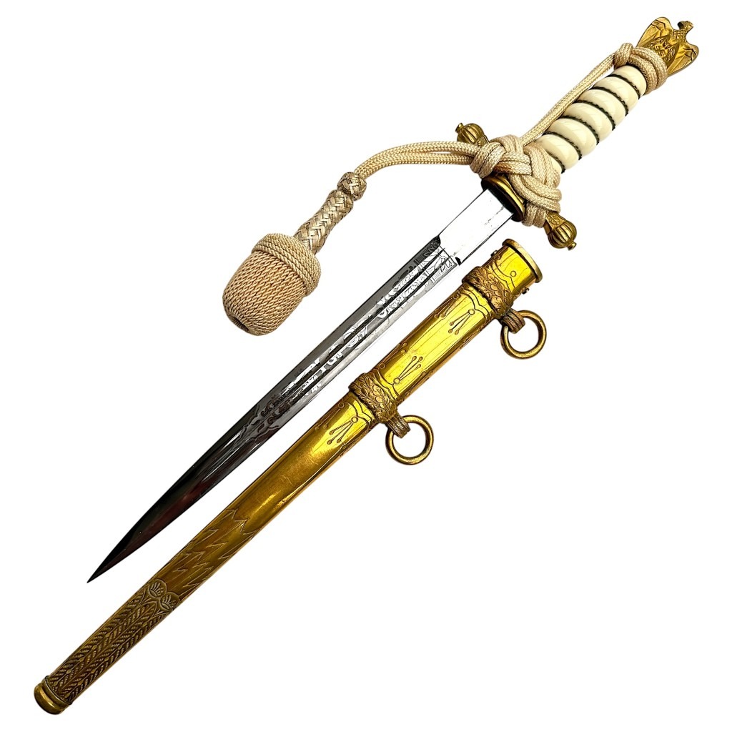 Original WWII German Kriegsmarine officer’s dagger with scabbard and portepee, made by Paul Weyersberg Solingen – rare World War Two naval dagger collectible for militaria and edged weapon collectors.