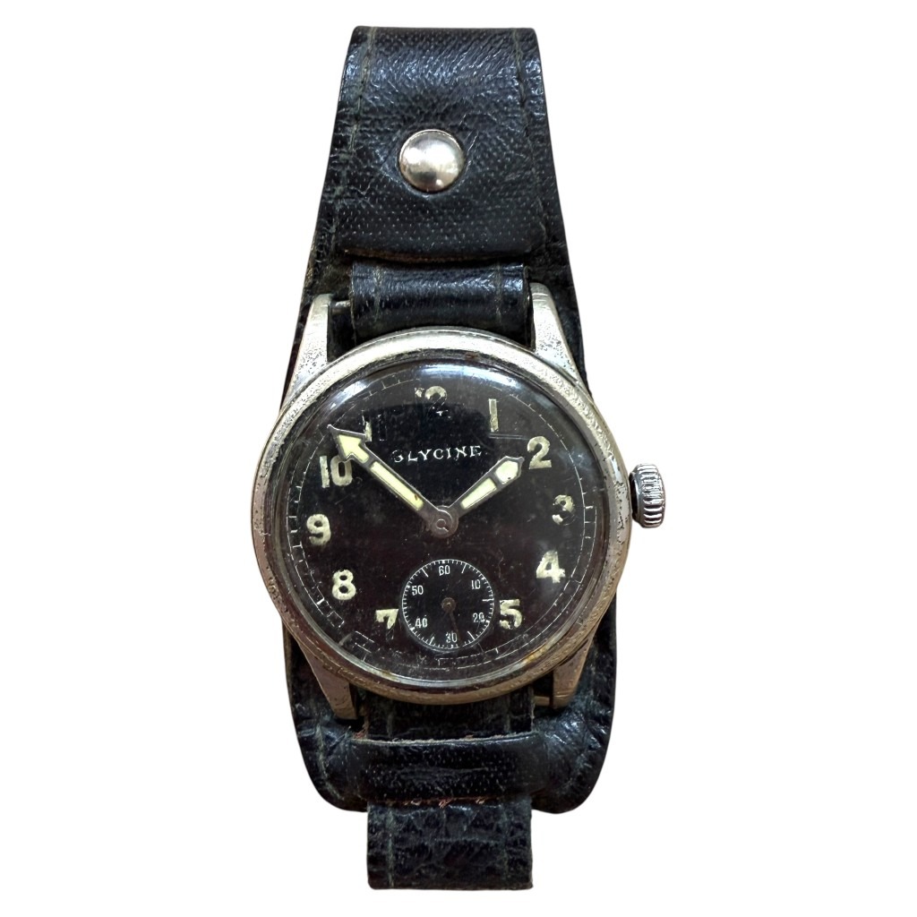Original WWII German Glycine Dienstuhr military wristwatch with black dial, luminous numerals, sub-seconds dial, and bund-style leather strap, issued to Wehrmacht soldiers during World War Two.