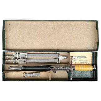 Original NVA DDR dagger for Land and Air Forces in box with suspension straps, belt loop and certificate – East German officer dagger complete set for collectors.