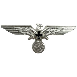 A metallic eagle with outstretched wings grips a swastika in a wreath, featuring a black Iron Cross at the center. This is an original WWII German Deutscher Reichskriegerbund breast eagle symbol from Nazi Germany.