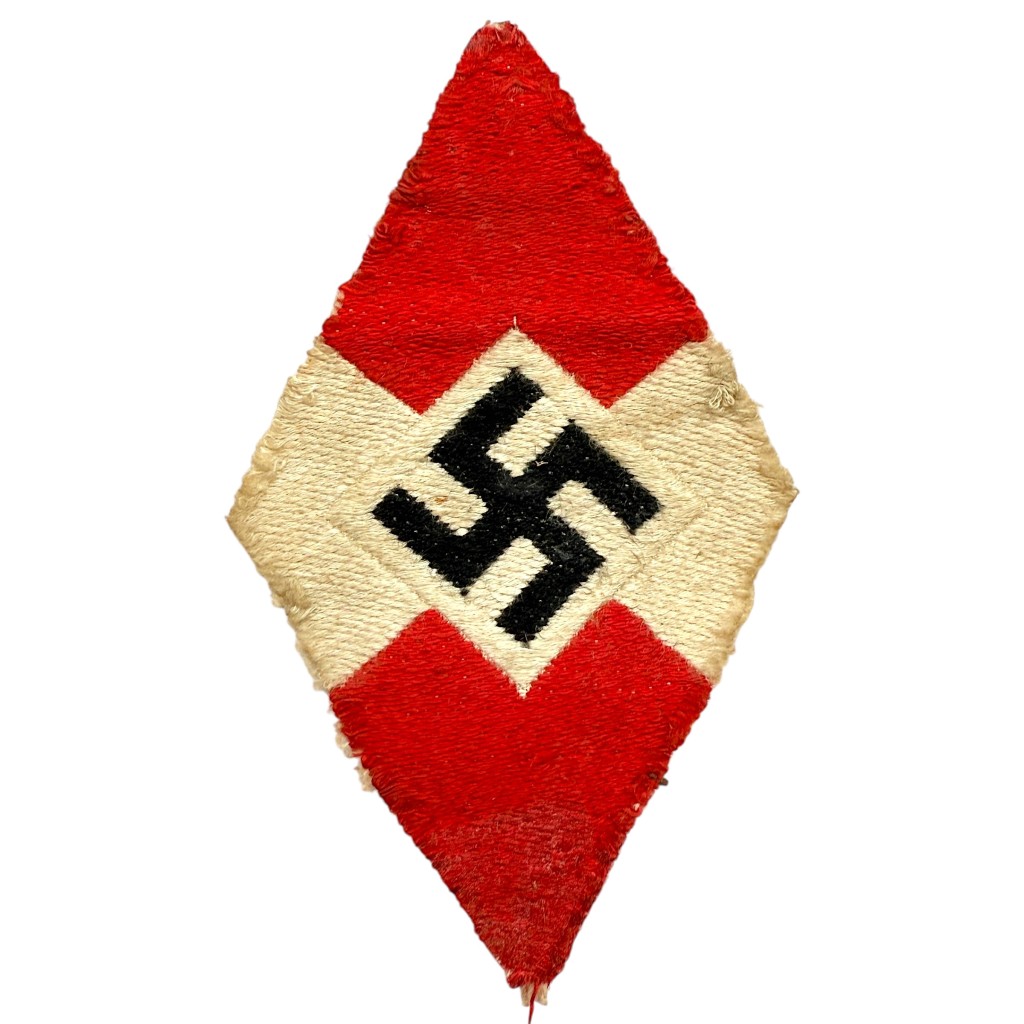 Original WWII German Hitler Youth (HJ) / BDM sleeve diamond insignia – red and white woven cloth patch with black swastika emblem, used on youth uniforms.