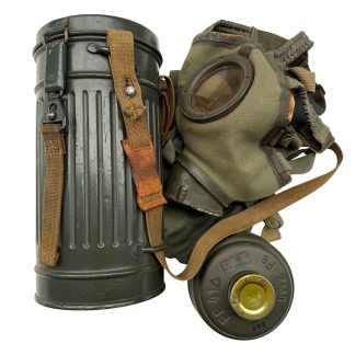 Original WWII German M31 gas mask in canister with straps and pouch