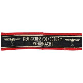 Original WWII German Volkssturm armband – “Deutscher Volkssturm Wehrmacht” printed cotton armband with red edges and black field, featuring eagle insignia. Authentic late-war German armband, highly collectible for Volkssturm, Wehrmacht, and World War II militaria collectors.