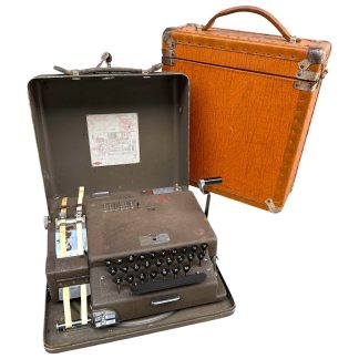 Original WWII Hagelin BC-543 cipher machine with carrying case – Rare Swedish encryption device developed in 1943 by Boris Hagelin, complete with original leather case, used for military and intelligence communications.