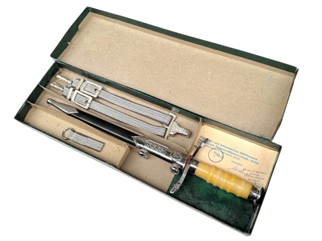 Complete East German NVA officer dagger in original box with scabbard, hangers and paperwork – DDR militaria collectible.