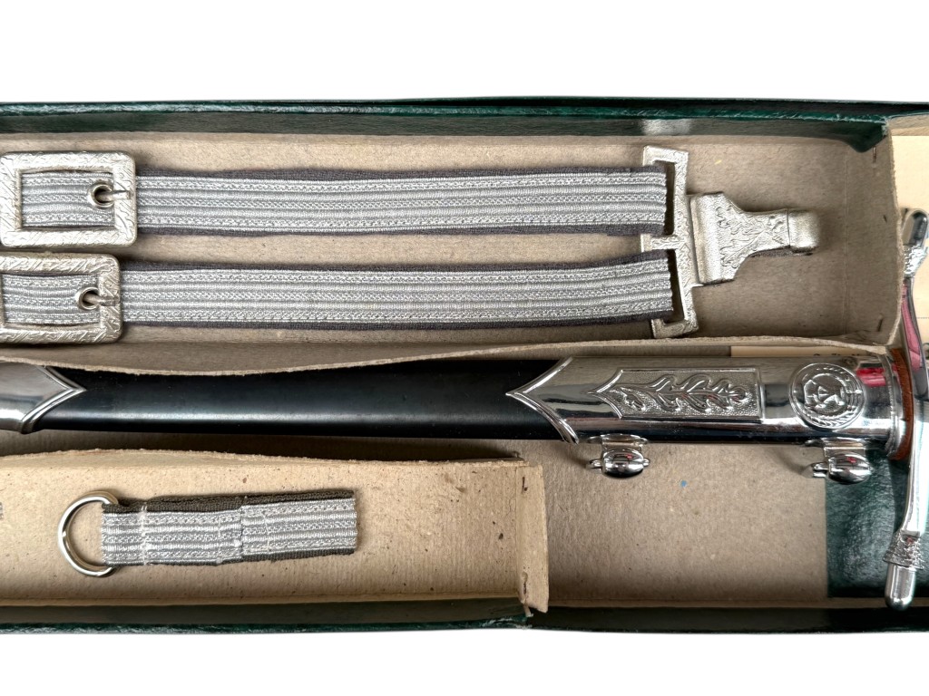 Silver suspension straps and scabbard of East German NVA officer dagger – DDR militaria with detailed fittings.
