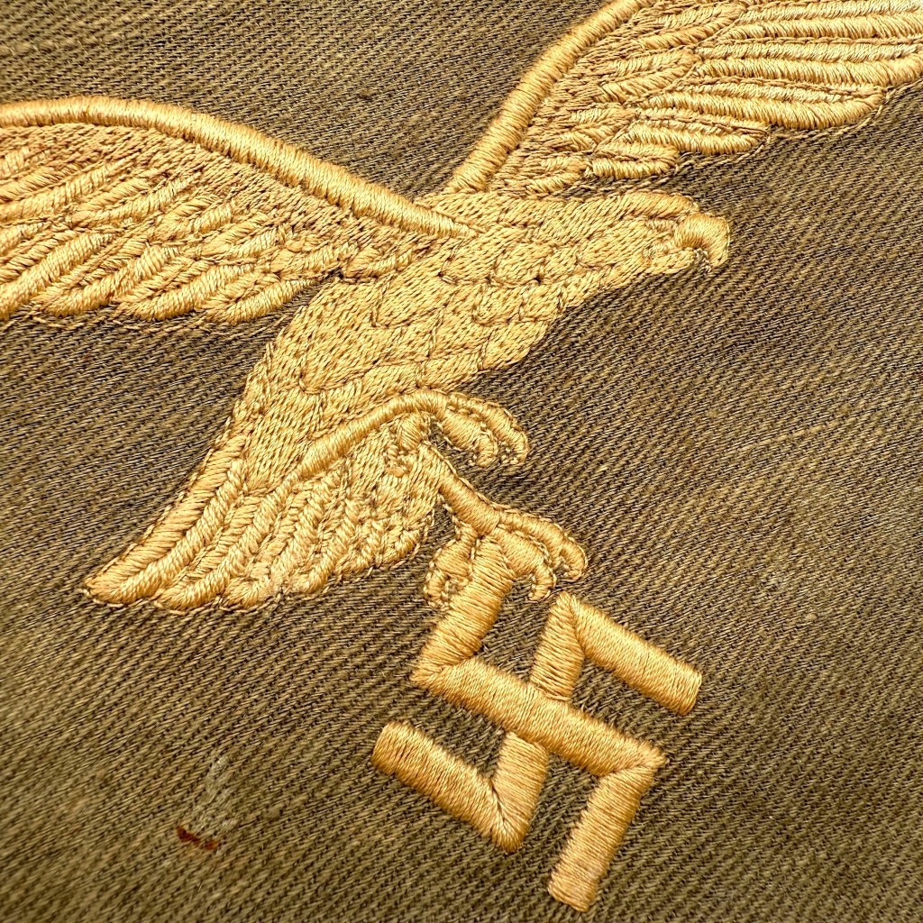 Original WWII German Luftwaffe officer’s car pennant flag in field-grey cloth with embroidered eagle and swastika emblem, rare WW2 Luftwaffe vehicle flag for militaria collectors.