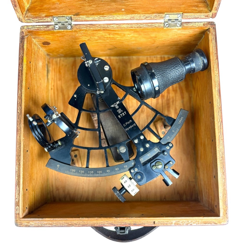 Original WWII German Kriegsmarine sextant by C. Plath Hamburg with engraved eagle and swastika Kriegsmarine "M" mark, serial number 3737, complete with wooden box, sun filters, and leather handle – rare World War II naval navigation instrument for Kriegsmarine militaria collectors.