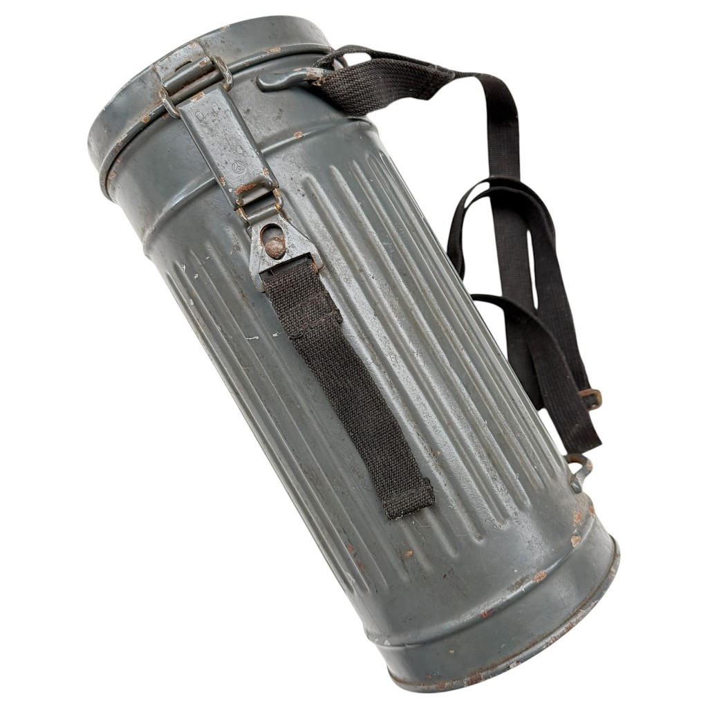 Original WWII German Luftwaffe gas mask canister – 1939 dated, ribbed metal construction with grey-blue Luftwaffe finish and original carrying straps. Perfect piece for WWII militaria and Luftwaffe collectors.