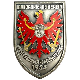 Original 1935 NSKK plaque – Motorbrigade Berlin Brandenburgische Geländefahrt. Rare German pre-WWII metal shield with red and gold enamel eagle emblem and NSKK insignia, maker-marked Rob. Neff Berlin W.57. Authentic NSKK and Berlin World War II militaria collectible.
