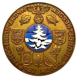 Original 1937 NSKK plaque – Nachtsuchfahrt Motor-Gruppe Hessen. Gilt metal with enameled central shield depicting white fir tree on blue background, surrounded by regional crests and oak leaves. Authentic pre-WWII German NSKK collectible made by E.F. Wiedmann Frankfurt.