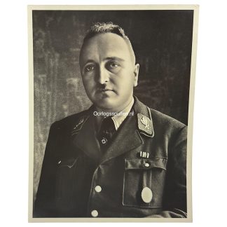 Original WWII German portrait photograph of Dr. Robert Ley, high-ranking Nazi official, wearing NSDAP uniform with insignia and medals. Authentic World War Two German photo collectible for militaria and Third Reich history collectors.