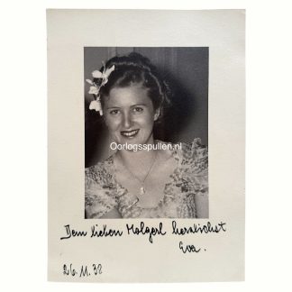 Original 1938 German portrait photograph with Eva Braun smiling at the camera, mounted on cardstock with handwritten German inscription and date “26. 11. 38”; WWII-era collectible photo attributed to Eva Braun, ideal for World War II memorabilia and Third Reich history collectors.