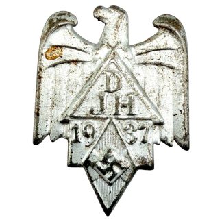 Original 1937 German Hitler Youth pin associated with Deutsche Jugendherbergen (DJH), featuring eagle, triangular DJH emblem, swastika, and original safety-pin backing; authentic WWII Hitler Youth collectible with visible age wear, ideal for militaria and historical memorabilia collectors.