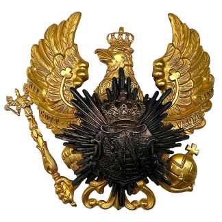 Original WW1 German Prussian Pickelhaube helmet plate featuring the large gilt Prussian eagle with the motto “Mit Gott für König und Vaterland” and a dark-patinated breast star emblem.