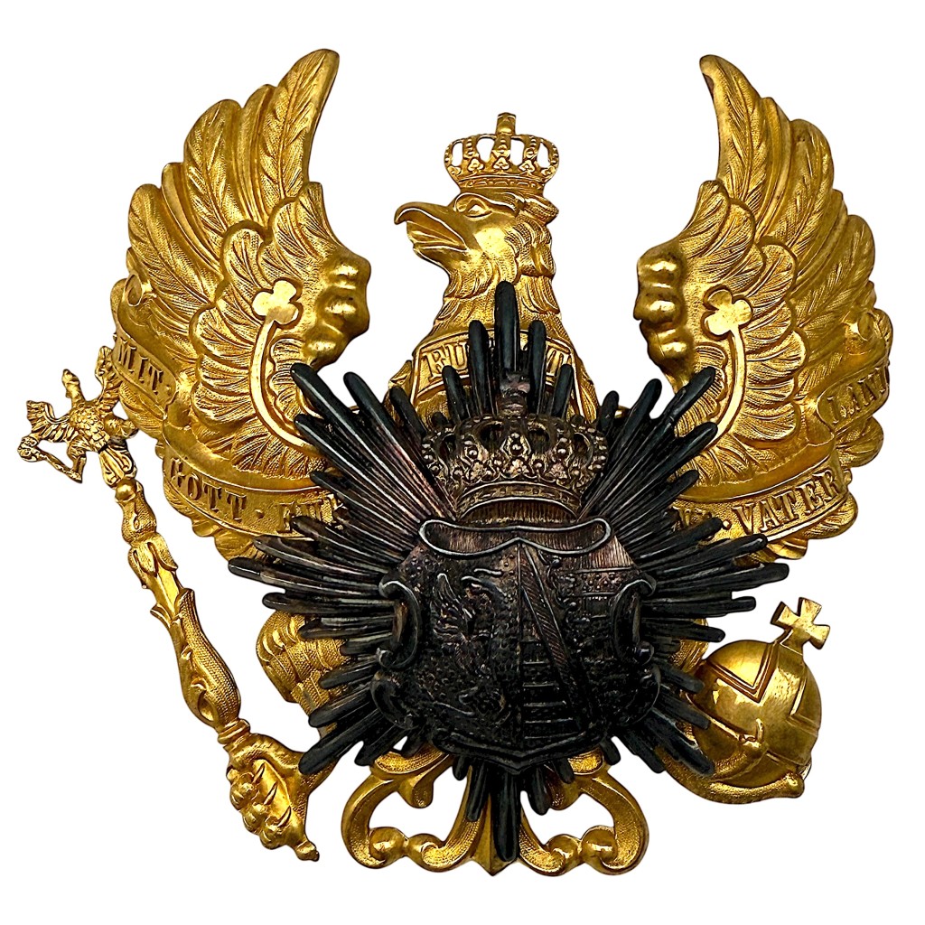 Original WW1 German Prussian Pickelhaube helmet plate featuring the large gilt Prussian eagle with the motto “Mit Gott für König und Vaterland” and a dark-patinated breast star emblem.
