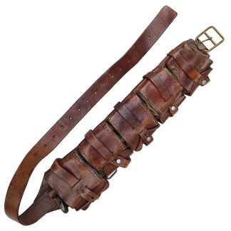Original WW1 Swedish M10 cartridge bandolier made of brown leather with individual ammunition pouches and shoulder strap – rare Scandinavian militaria collectible.