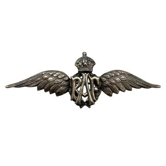 Original WWII sterling silver Royal Air Force pilot wing badge with RAF monogram and King’s Crown, sought-after RAF militaria for collectors.