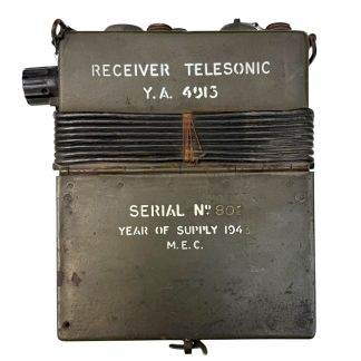 Original WWII British SOE Resistance Receiver Telesonic 1943 – rare clandestine communication device with induction coil, military-green metal case, stencil markings “Receiver Telesonic Y.A. 4913,” volume control, cable windings, headphone and coil pick-up ports, complete instruction label – highly collectible WWII spy and resistance equipment.