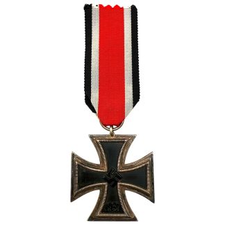 Original World War II Iron Cross 2nd Class, maker-marked 100 (Wächtler & Lange), featuring 1939 and 1813 dates, iron core with silvered frame, complete with original ribbon—authentic German military award sought after by Iron Cross and WWII medal collectors.