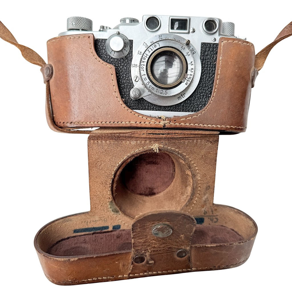 Original WWII German Kriegsmarine Leica camera by Ernst Leitz Wetzlar with Hektor 5cm f/2.5 lens, rare military-issued model with Kriegsmarine eagle marking, complete with leather case – unique collectible for Kriegsmarine and World War II militaria enthusiasts.