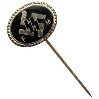 Angled view of WWII German SS FM Fördernde Mitglieder stickpin displaying black enamel oval badge with SS rune emblem, beaded edge border, and long twisted metal pin shaft; historical German militaria collectible.