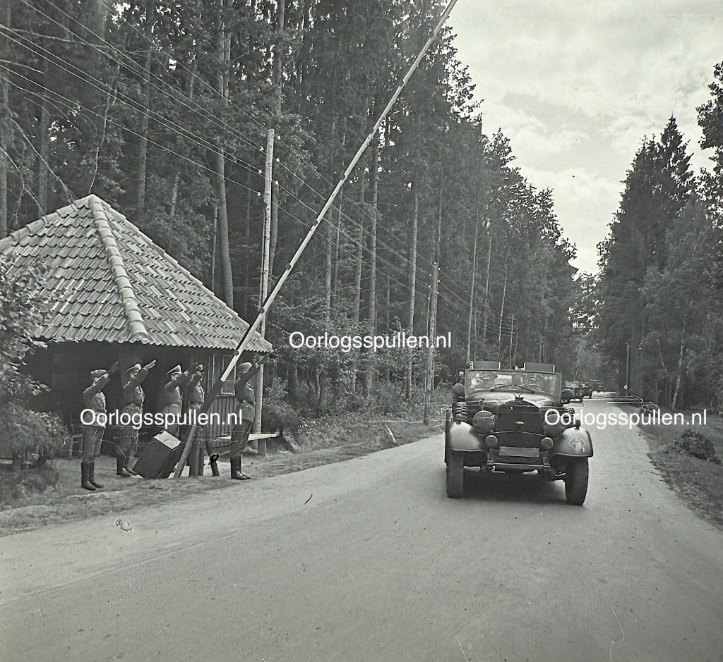 Original WWII German photo positive showing SS guards saluting Adolf Hitler’s arrival at the Wolfsschanze headquarters, rare unpublished Third Reich military photograph, Wolf’s Lair collector’s item.