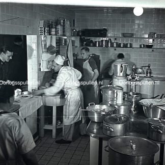 Original WWII German photo positive of the kitchen inside the Wolfsschanze showing an SS man collecting food, rare unpublished Third Reich headquarters kitchen scene, authentic Wolf’s Lair photograph for WWII photo collectors.