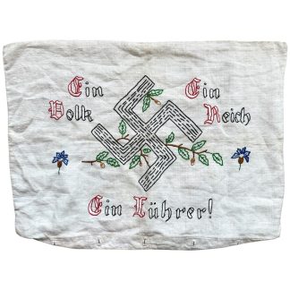 Authentic 1930s German embroidered pillowcase featuring oak leaves and the slogan “Ein Volk, Ein Reich, Ein Führer.” Original Nazi-era household textile, ideal for WWII militaria collectors, museums, and historical study. 56 × 40 cm.