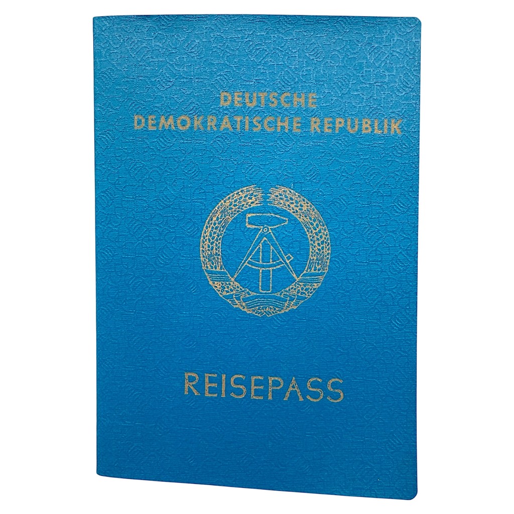 Original DDR passport Reisepass issued in Strausberg 1988, German Democratic Republic travel document with stamps and visa, Cold War collectible for East Germany and DDR history collectors.