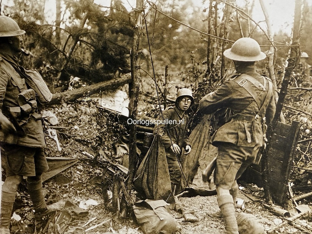 Original First World War photograph showing a German soldier surrendering during the Champagne battles, WW1 trench warfare scene with Allied soldiers, barbed wire and destroyed forest, mounted period photo 18 x 13 cm, authentic World War I military collectible for WW1 history collectors and militaria enthusiasts.