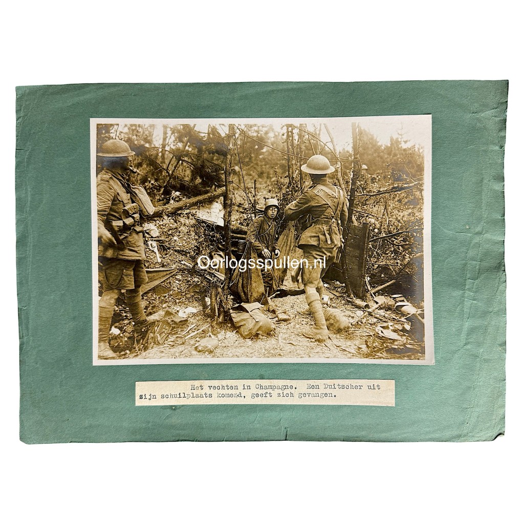 Original First World War photograph showing a German soldier surrendering during the Champagne battles, WW1 trench warfare scene with Allied soldiers, barbed wire and destroyed forest, mounted period photo 18 x 13 cm, authentic World War I military collectible for WW1 history collectors and militaria enthusiasts.