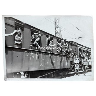 Original French World War II press photograph showing Légion des Volontaires Français (L.V.F.) volunteers departing by train, wagon marked “L.V.F.” and “Paris–Moscou,” rare 1942 LVF collaboration image with press stamps and censorship marks, highly collectible WWII French collaboration photography.