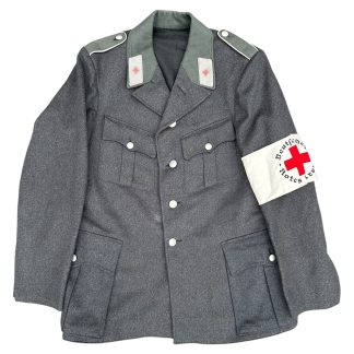 Original WWII German DRK (Deutsches Rotes Kreuz) uniform jacket with armband, Kreisstelle Saarbrücken marked, field-grey wool tunic with dark green collar, red cross collar tabs, aluminum buttons, and white DRK armband with red cross, authentic German Red Cross militaria collectible.