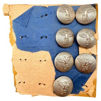 Original German NSDAP uniform buttons on original cardboard backing, dating from the 1930s–1940s, featuring seven silver-colored metal buttons with eagle and swastika insignia, intact fastening loops on the reverse, authentic WWII-era militaria collectible for serious military history and Third Reich collectors.