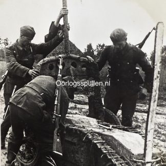 Original WWII German photograph of a Goliath remote-controlled explosive vehicle being prepared by German soldiers in the field, rare Wehrmacht pioneer weapon in action, official German press photo by Kriegsberichter Schlegel-Bregenz dated 22 July 1944, extremely rare Goliath demolition vehicle image, collectible German militaria and military technology photograph, size 18 x 13 cm.