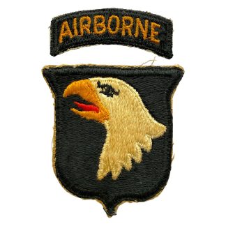 Original WWII US 101st Airborne Division “Screaming Eagle” shoulder patch with Airborne tab, embroidered insignia from World War II, authentic U.S. Army airborne collector’s item.
