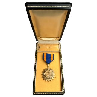 Authentic World War II U.S. Air Medal in original presentation box, bronze medal with blue and orange ribbon, complete WWII Army Air Forces decoration.