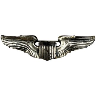 Original WWII USAAF pilot wing badge in sterling silver, marked STERLING on reverse, United States Army Air Forces pilot wings with spread wings and central shield, authentic World War II aviation militaria collectible for USAAF collectors.