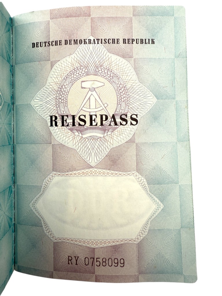 Original DDR passport Reisepass issued in Strausberg 1988, German Democratic Republic travel document with stamps and visa, Cold War collectible for East Germany and DDR history collectors.