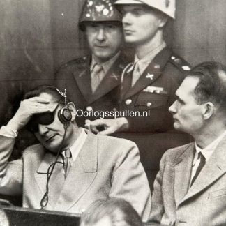 Original 1946 press photo of the Nuremberg Trials showing Hermann Göring with headphones and Rudolf Hess listening to the verdict of the International Military Tribunal in Nuremberg, Germany – WWII war criminals courtroom scene, 24 x 18 cm vintage photograph with Cleveland News stamp on verso.
