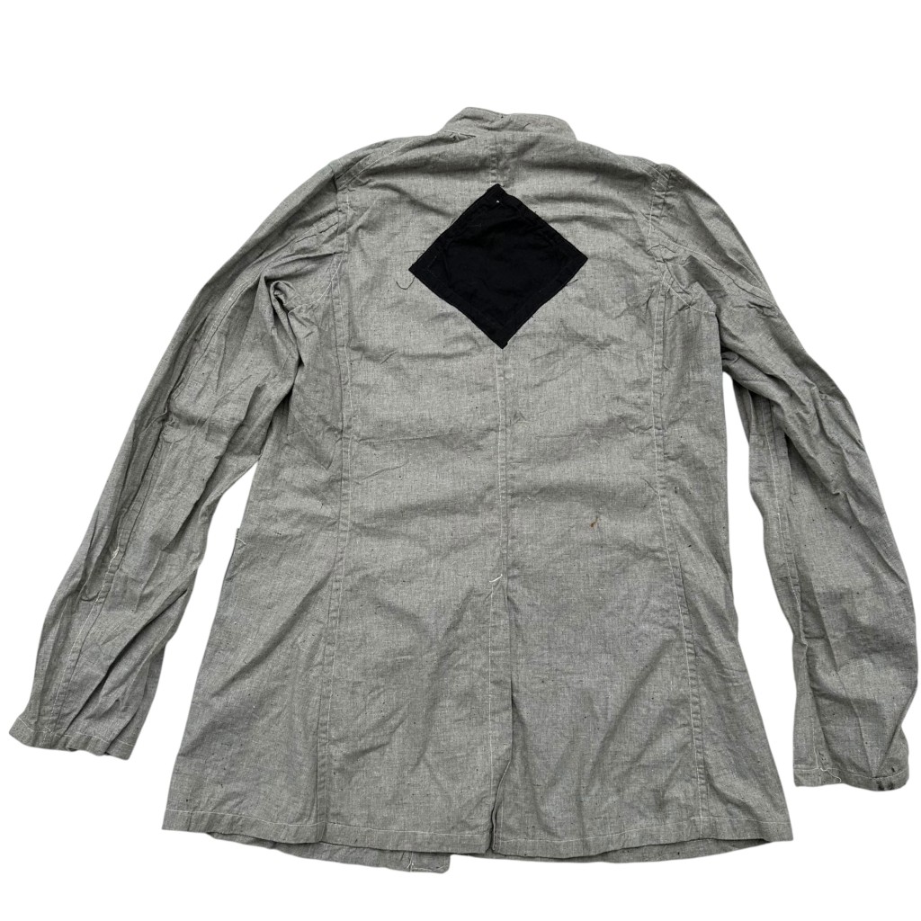 Original British WWII German POW jacket circa 1942, grey cotton prisoner of war uniform with black diamond identification patch on back, authentic World War II British camp issue clothing for German prisoners, rare POW militaria collectible