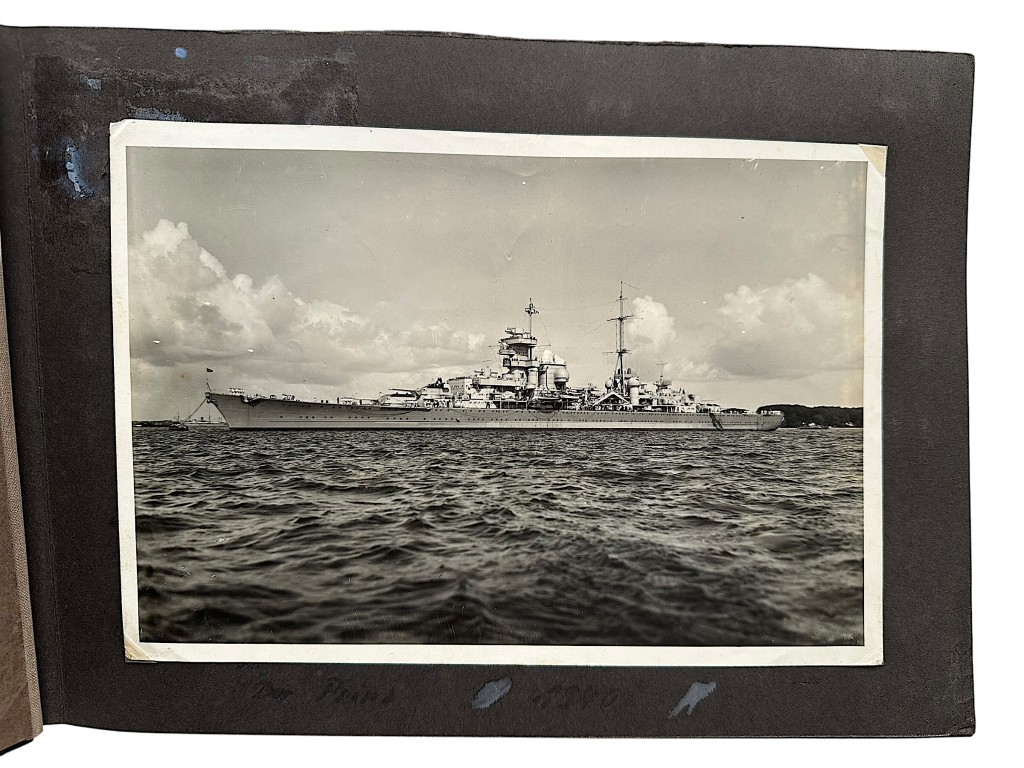 Kriegsmarine heavy cruiser Prinz Eugen original WWII photo album with 98 photographs showing naval combat, HMS Hood battle, HMS Prince of Wales engagement, crew life, gun turrets, torpedoes, anti-aircraft guns, ceremonies, officers inspections, Cossacks aboard ship and wartime naval operations.