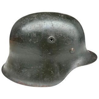 Original German M42 steel helmet CKL64 by Eisenhüttenwerk Thale with dark green period paint and original leather liner – WWII Wehrmacht helmet collectible militaria .