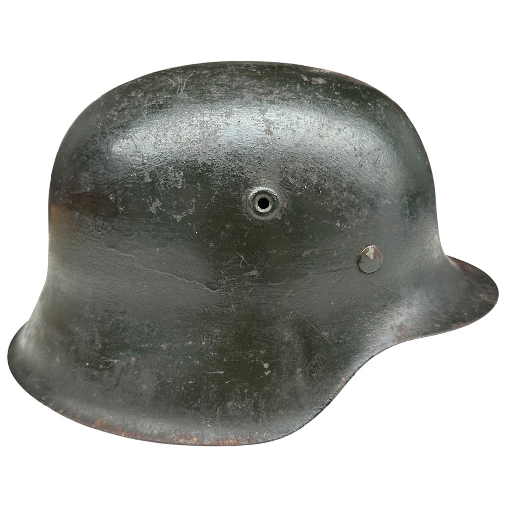 Original German M42 steel helmet CKL64 by Eisenhüttenwerk Thale with dark green period paint and original leather liner – WWII Wehrmacht helmet collectible militaria .