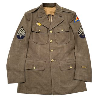 Original 1942 WWII U.S. Army Class A Service Dress Jacket 7th Army – Technician Third Grade T/3 rank insignia, Ruptured Duck honorable discharge patch, named Ben Greenholtz label, olive drab wool tunic, authentic US World War II uniform collectible militaria