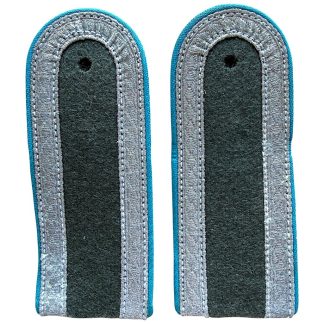 NVA/DDR Unteroffizier Luftstreitkräfte shoulder boards with blue piping, original East German Air Force shoulder straps, silver NCO tresse, field-grey fabric, Cold War militaria collectible, authentic Nationale Volksarmee uniform insignia.