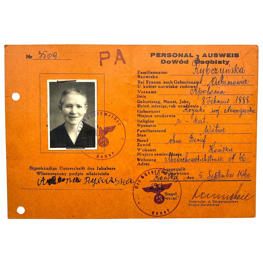 Original 1940 German-Polish Personal Ausweis (Dowód osobisty) identity document issued in Końskie, Poland during the Nazi occupation, featuring original passport photograph, handwritten personal details, Reich eagle and swastika official stamps, mayor’s signature, and serial number – authentic World War II ID card collectible for militaria and WWII document collectors.