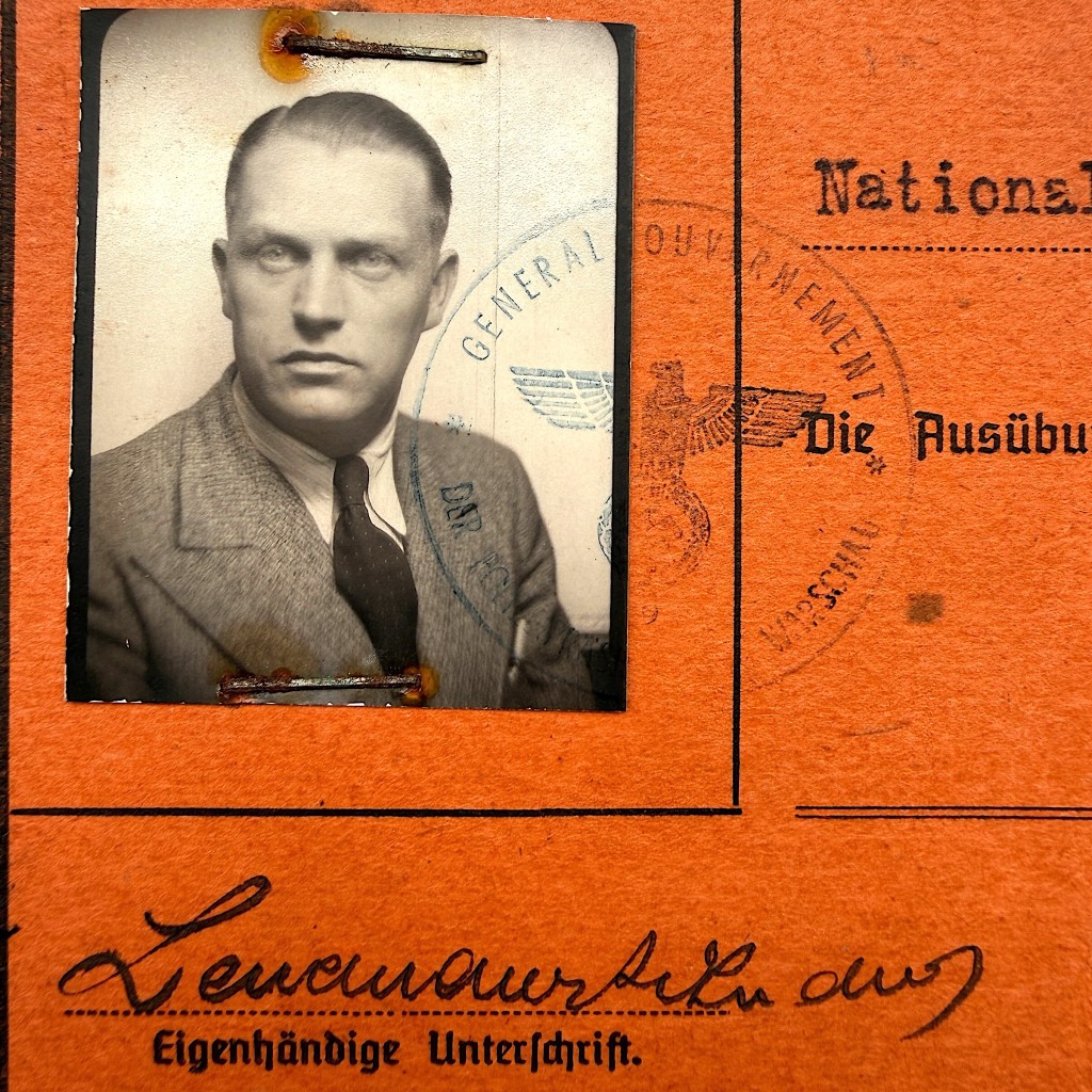 Close up portrait photo attached to German WWII weapons permit Waffenschein Warsaw General Government document