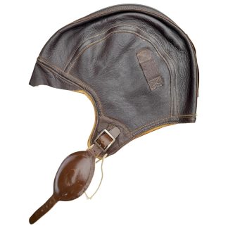 This U.S. Navy Aviator NAF 1092 Flight Cap is a historic piece of flight gear worn by pilots and aircrew of the United States Navy during World War II.